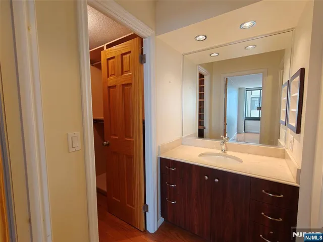 a bathroom with a double vanity sink and mirror