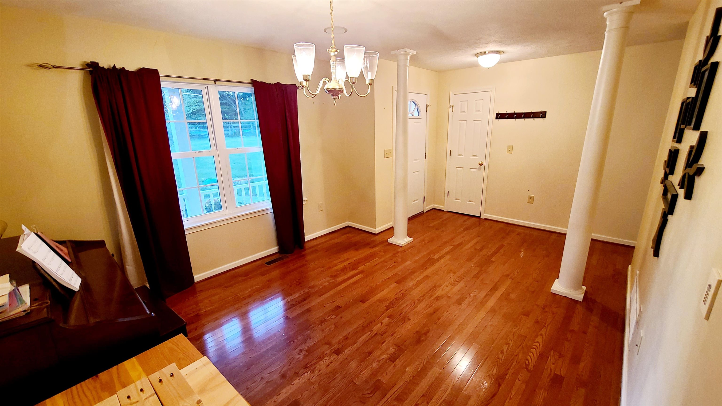 823 Battlefield Road Fort Defiance, VA 24437 - Photo 5 of 29 a view of a hallway with wooden floor and staircase