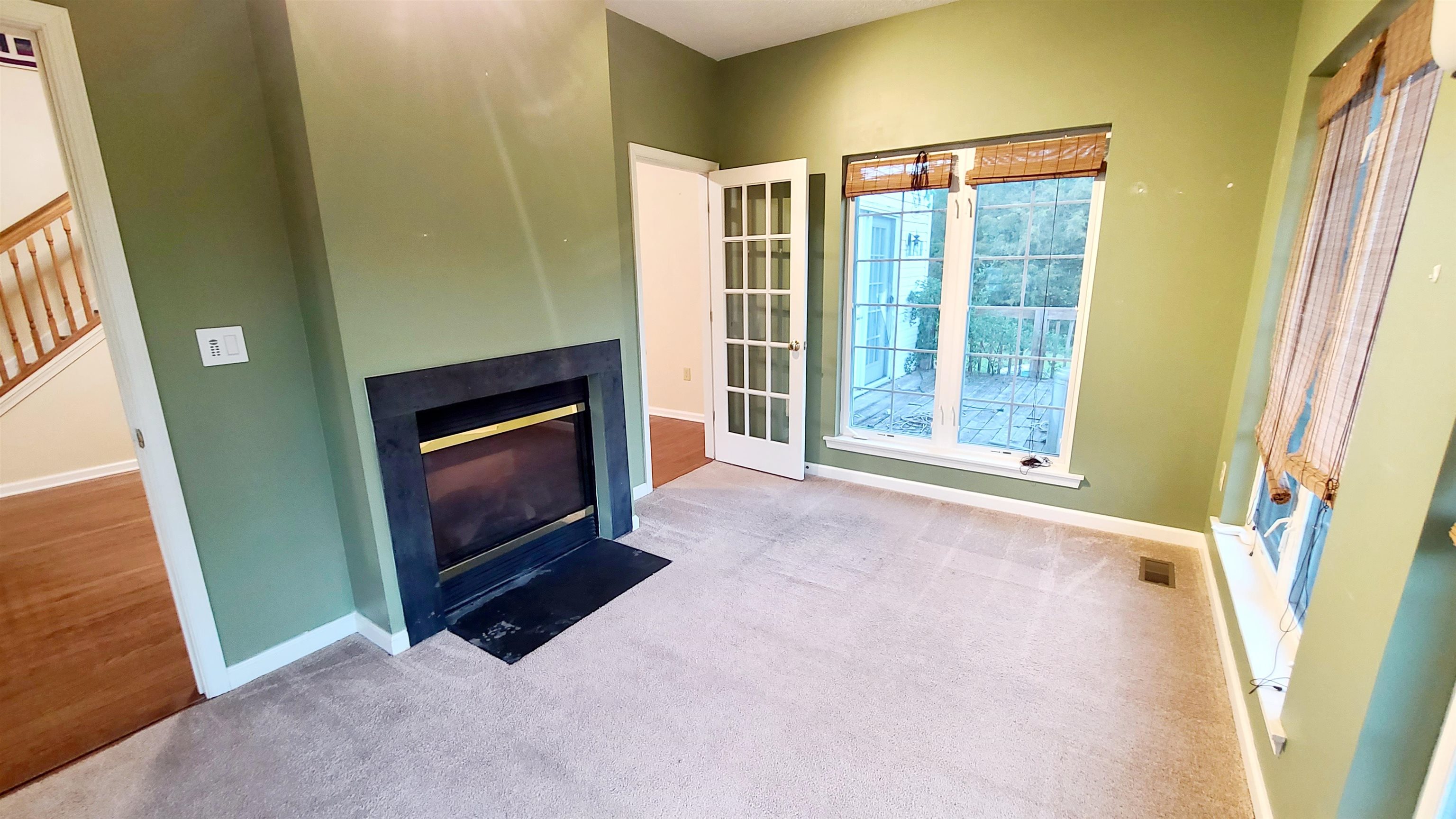823 Battlefield Road Fort Defiance, VA 24437 - Photo 8 of 29 a view of an empty room with a fireplace and a window