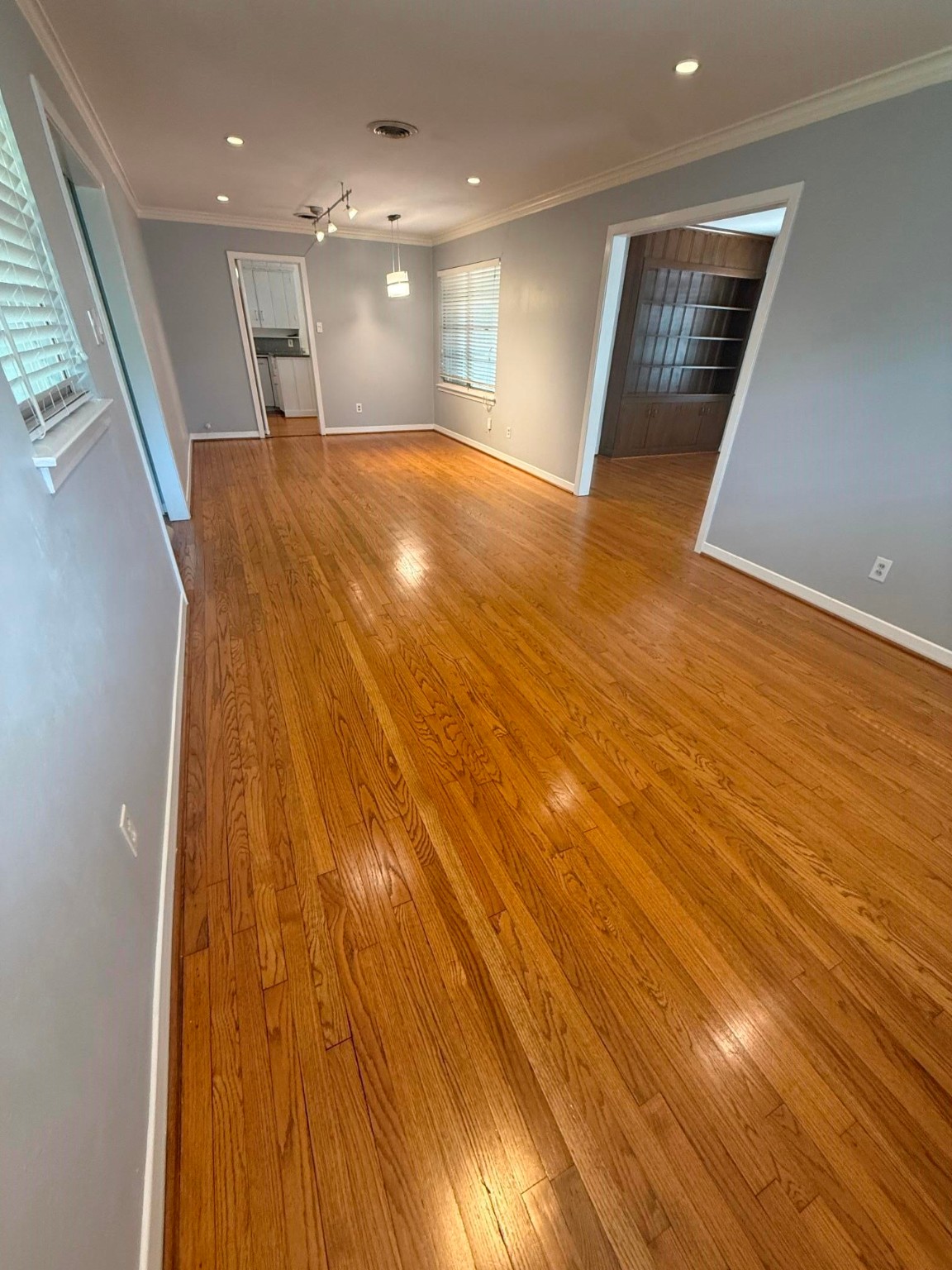 4114 Norfolk Street Houston, TX 77027 - Photo 2 of 7 an empty room with wooden floor and natural light
