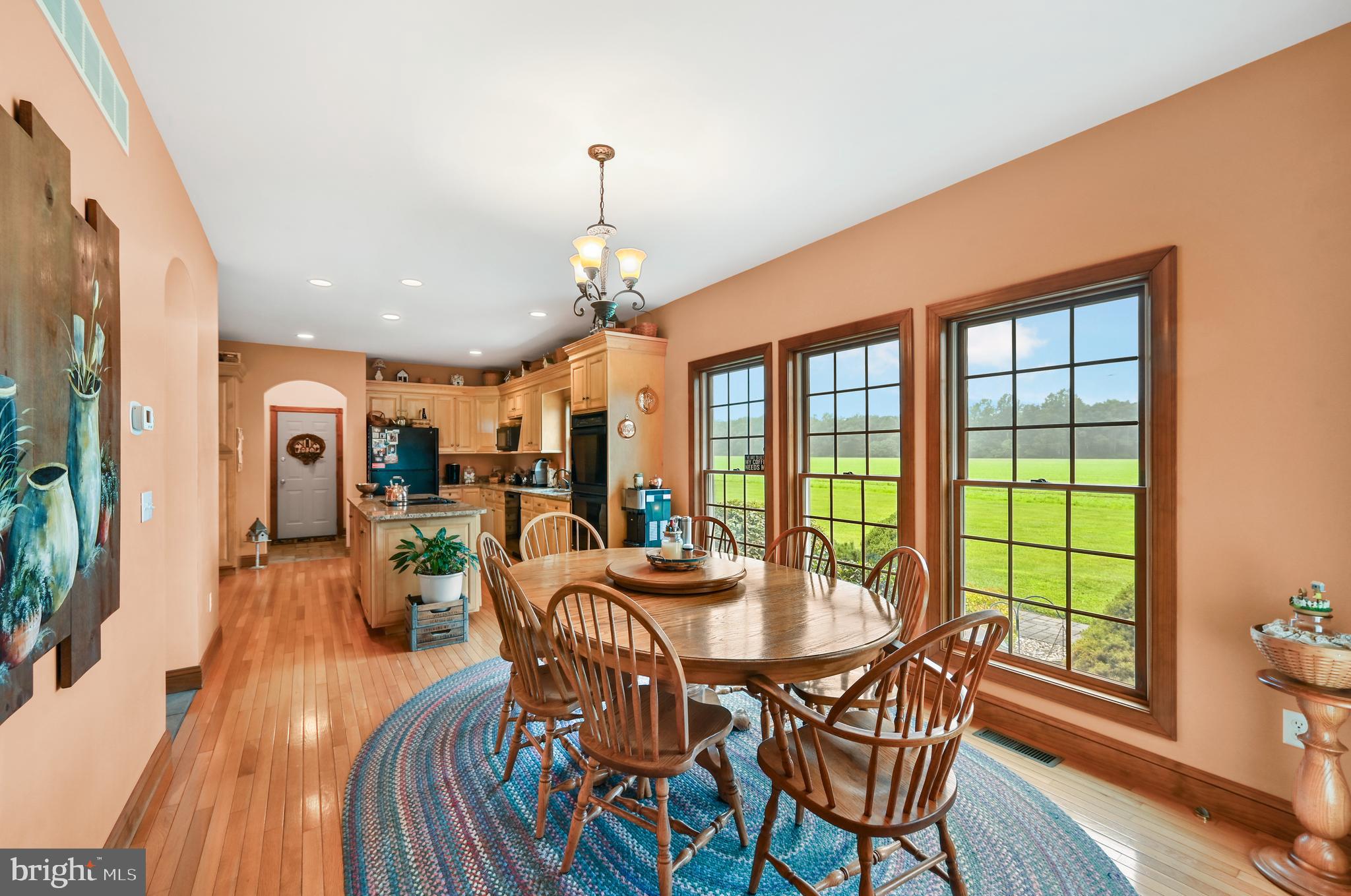 1495 Midstate Road Felton, DE 19943 - Photo 6 of 25 a dining room with furniture window and wooden floor
