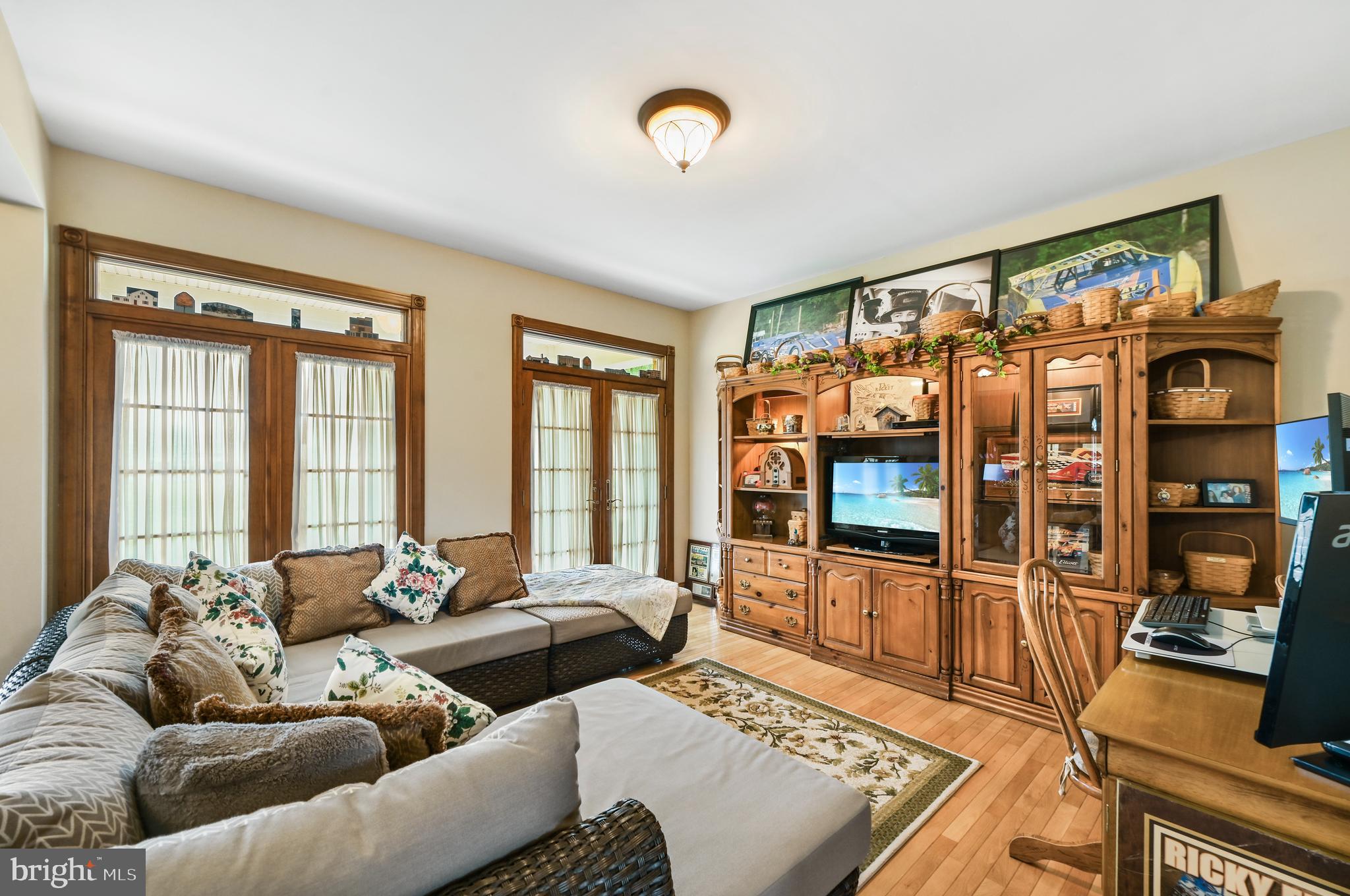 1495 Midstate Road Felton, DE 19943 - Photo 9 of 25 a living room with furniture fireplace and flat screen tv