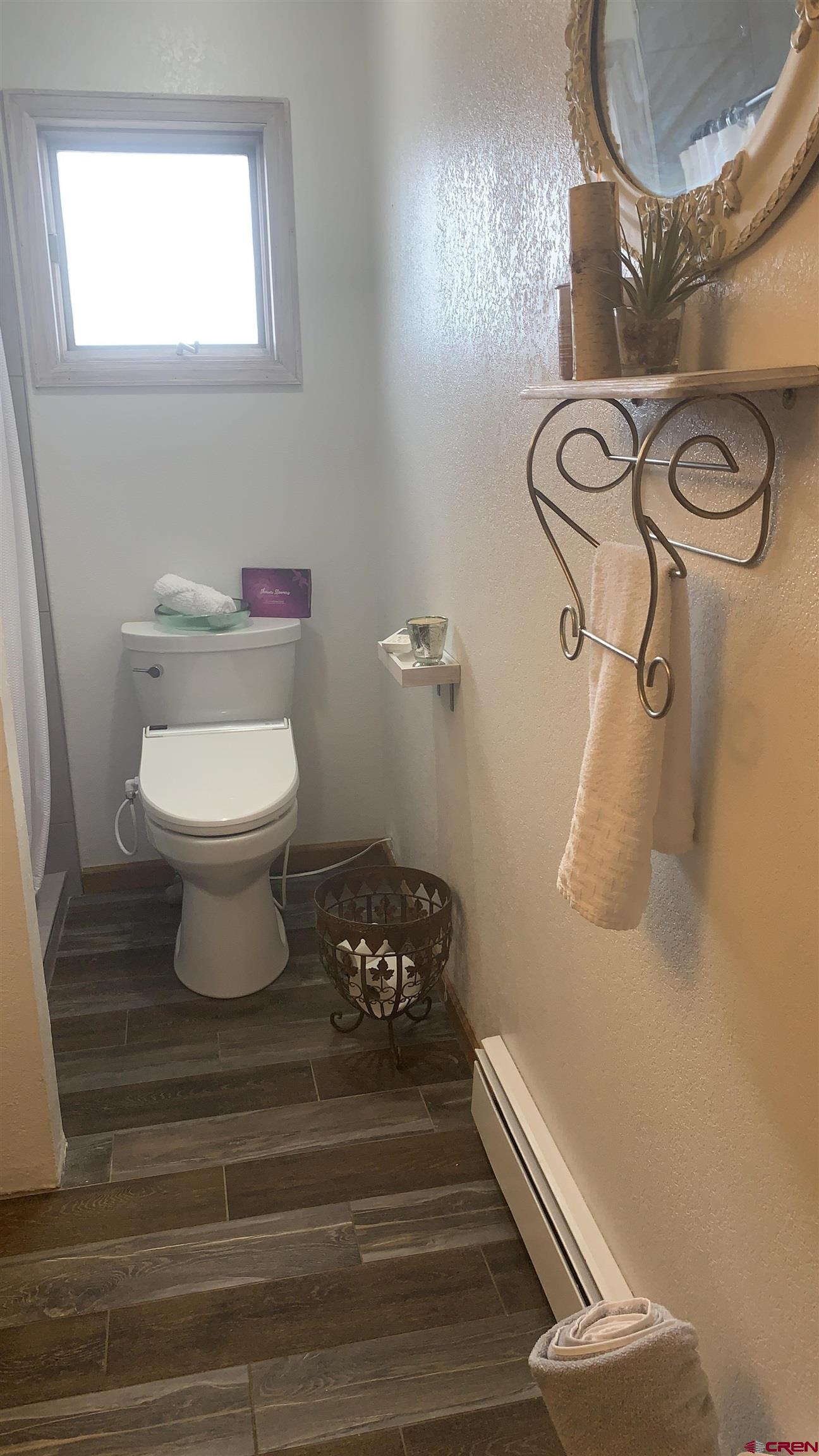 58811 Banner Road Olathe, CO 81425 - Photo 18 of 35 a bathroom with a toilet and a sink