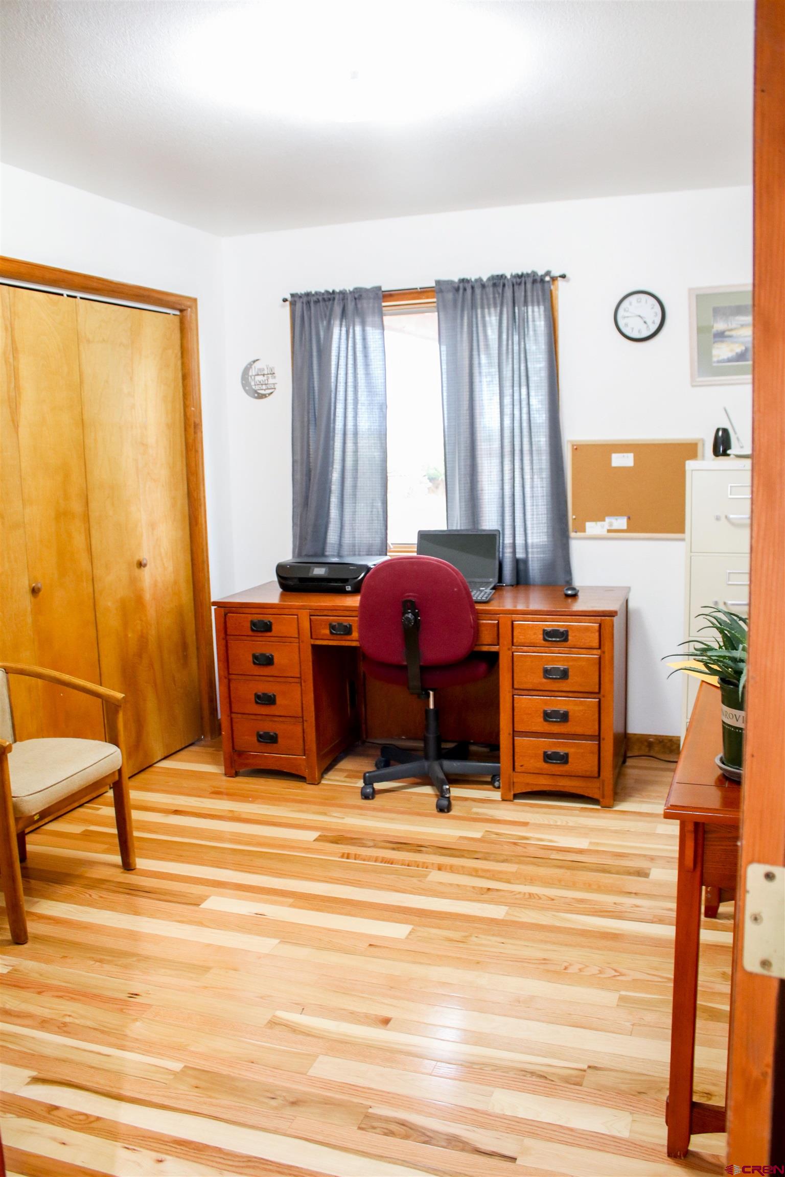 58811 Banner Road Olathe, CO 81425 - Photo 22 of 35 a living room with furniture and a large window