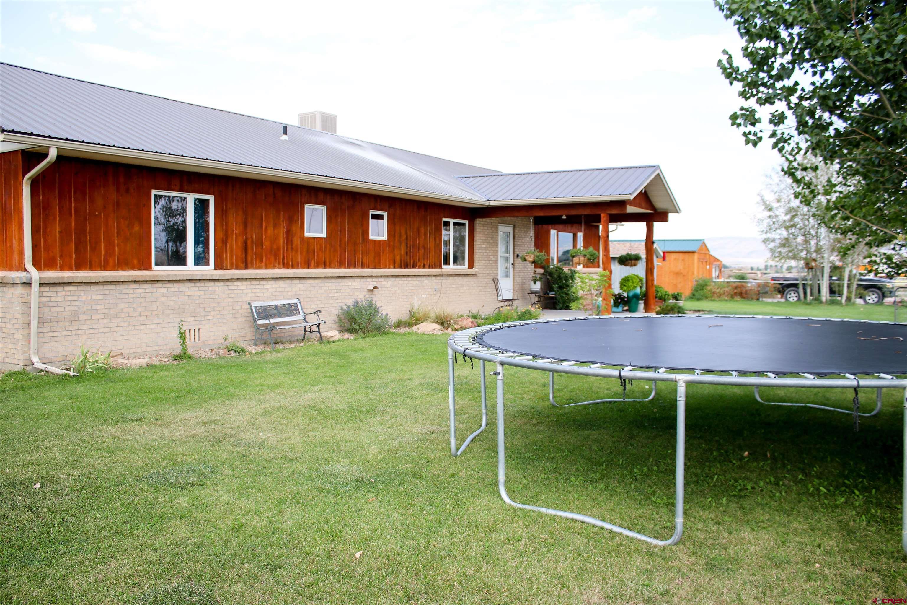 58811 Banner Road Olathe, CO 81425 - Photo 29 of 35 a view of house with backyard