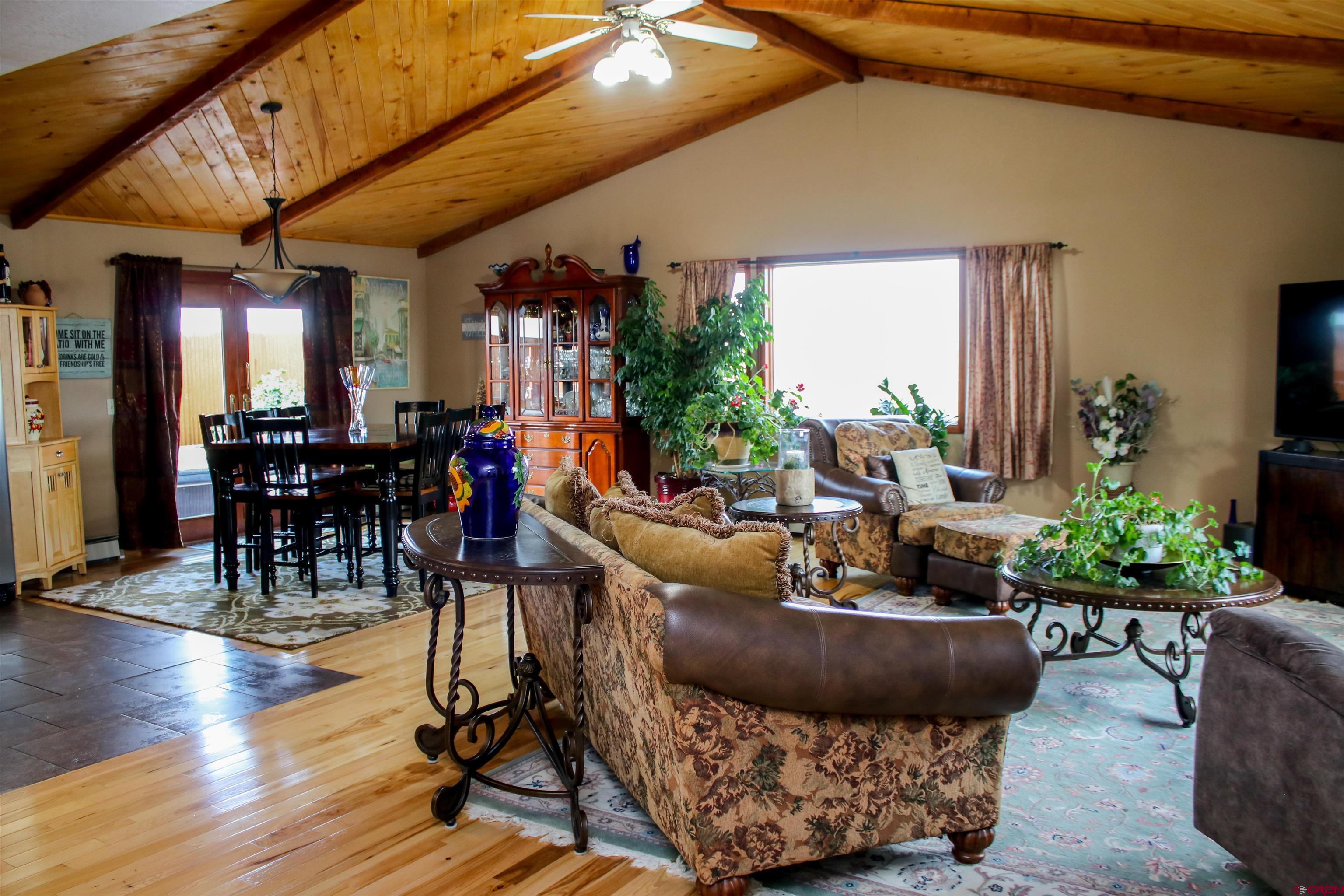 58811 Banner Road Olathe, CO 81425 - Photo 5 of 35 a living room with furniture and wooden floor