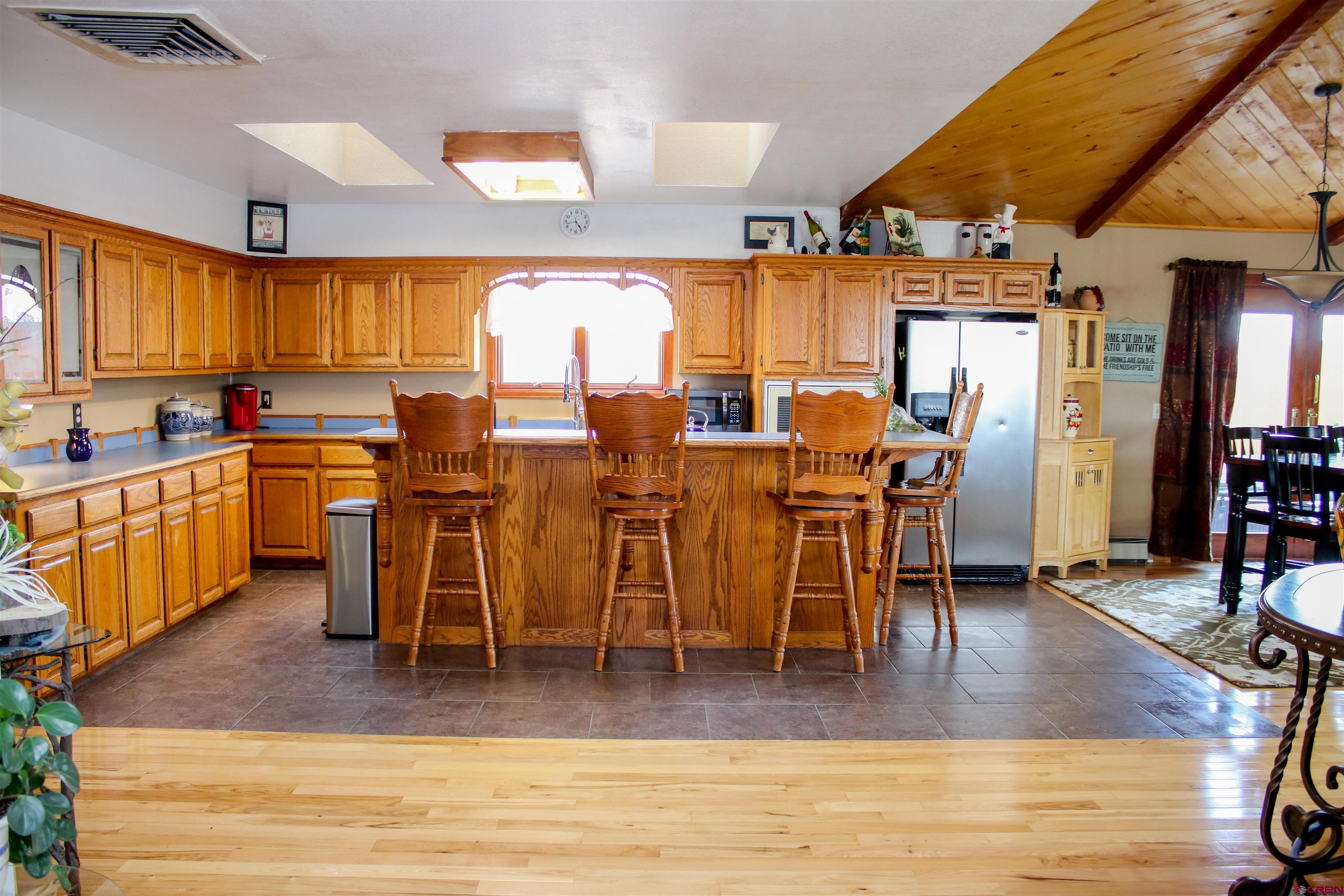 58811 Banner Road Olathe, CO 81425 - Photo 9 of 35 a view of a dining room with furniture window and wooden floor