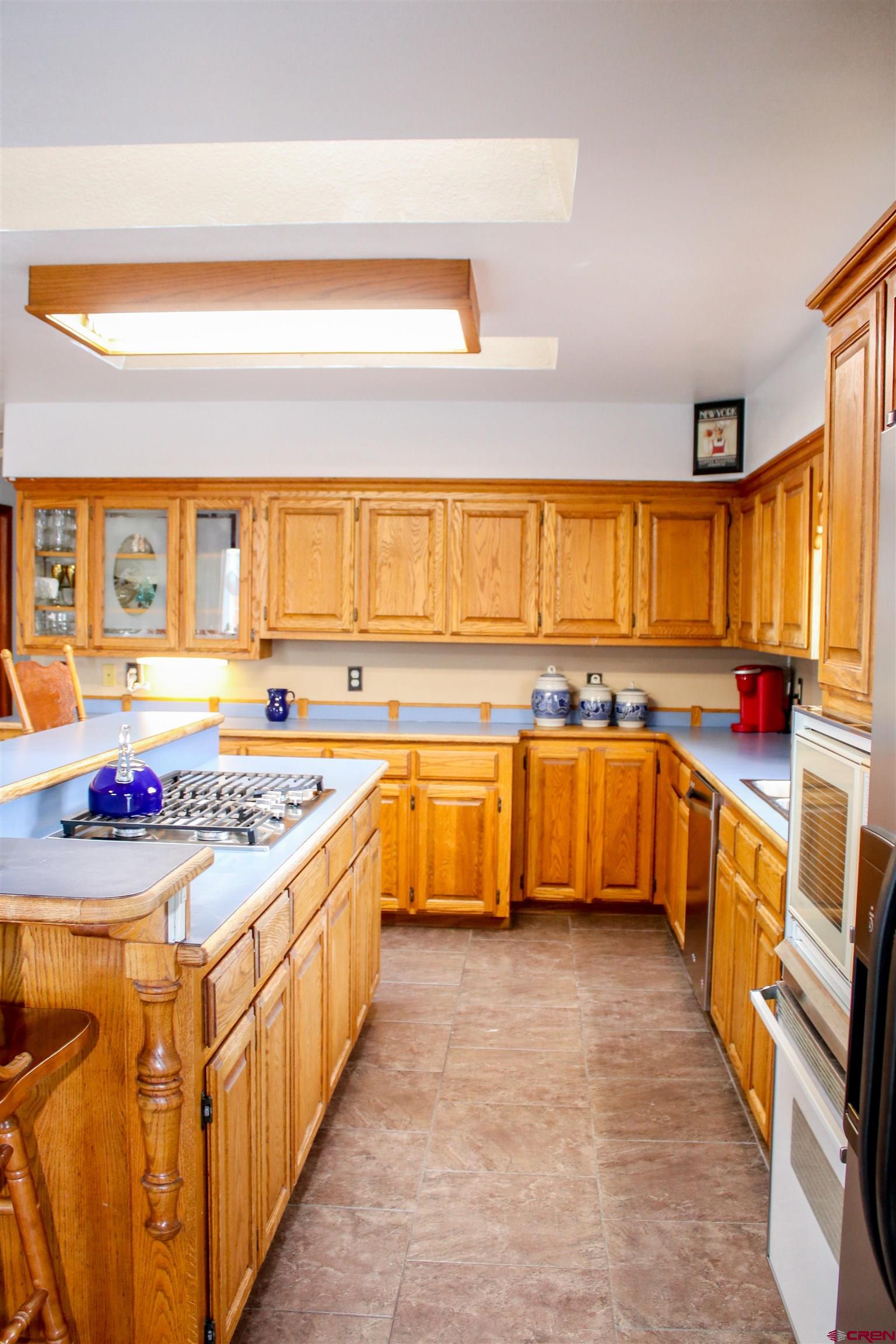 58811 Banner Road Olathe, CO 81425 - Photo 10 of 35 a kitchen with stainless steel appliances a sink and a stove