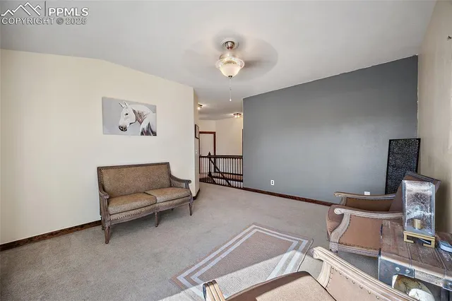 a living room with furniture and a night stand