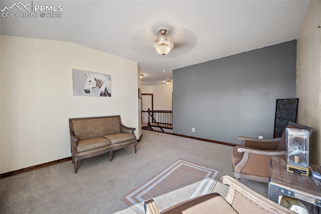 7015 Reunion Circle Fountain, CO 80817 - Photo 18 of 41 a living room with furniture and a night stand