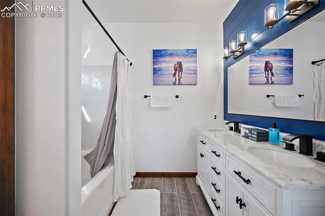 a bathroom with a sink a vanity and a mirror