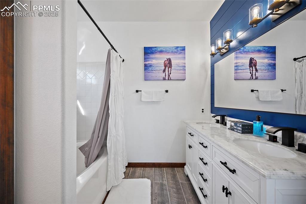 7015 Reunion Circle Fountain, CO 80817 - Photo 24 of 41 a bathroom with a sink a vanity and a mirror