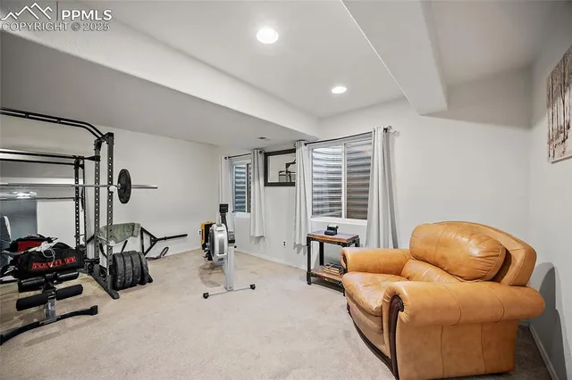 a livingroom with furniture and a large window