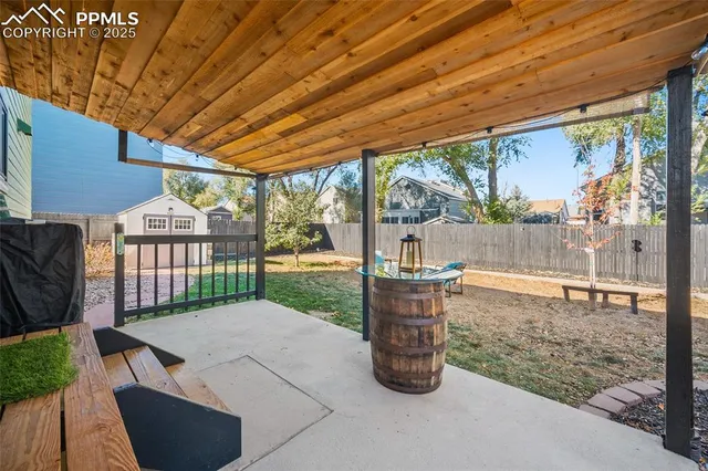 a view of a porch with furniture and garden