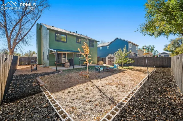 a view of a brick house with a yard