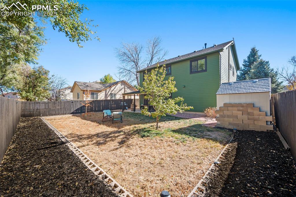 7015 Reunion Circle Fountain, CO 80817 - Photo 32 of 41 a view of a house with a yard and pathway
