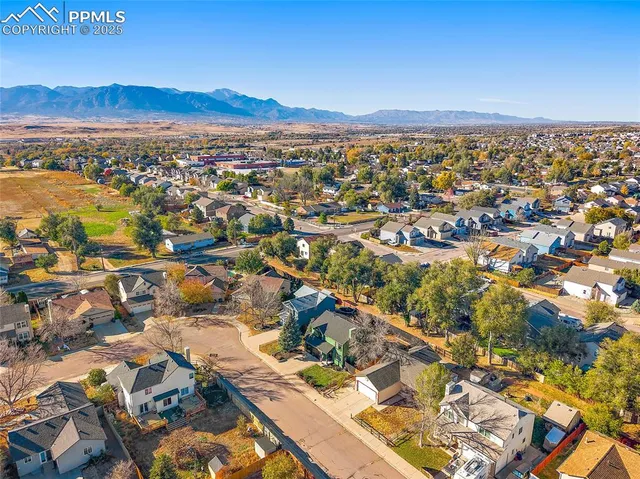an aerial view of residential building and trees