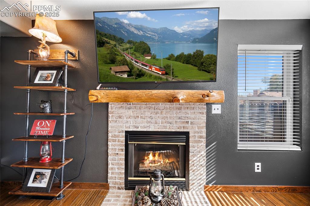 7015 Reunion Circle Fountain, CO 80817 - Photo 4 of 41 a view of a room that has a couch and a fireplace