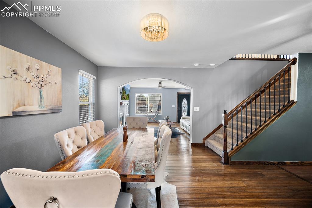 7015 Reunion Circle Fountain, CO 80817 - Photo 7 of 41 a living room with furniture and a chandelier