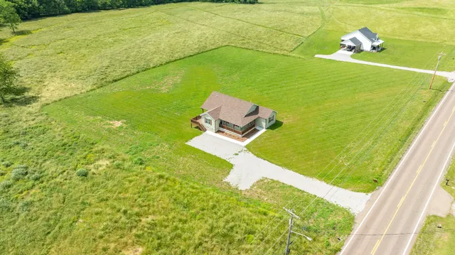 a view of a yard with a lake view