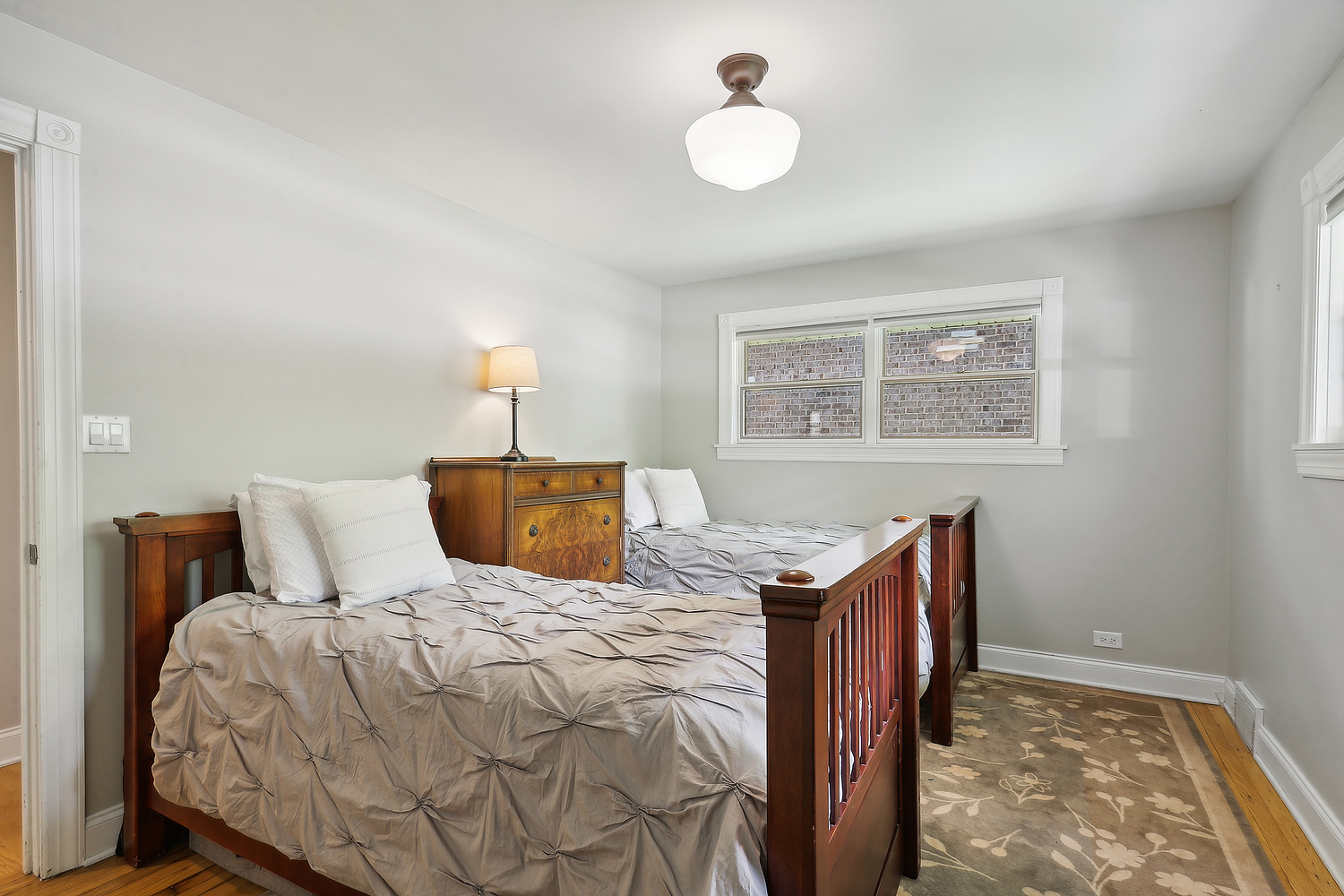 2432 Illinois Road Northbrook, IL 60062 - Photo 16 of 22 a bedroom with a bed and a window