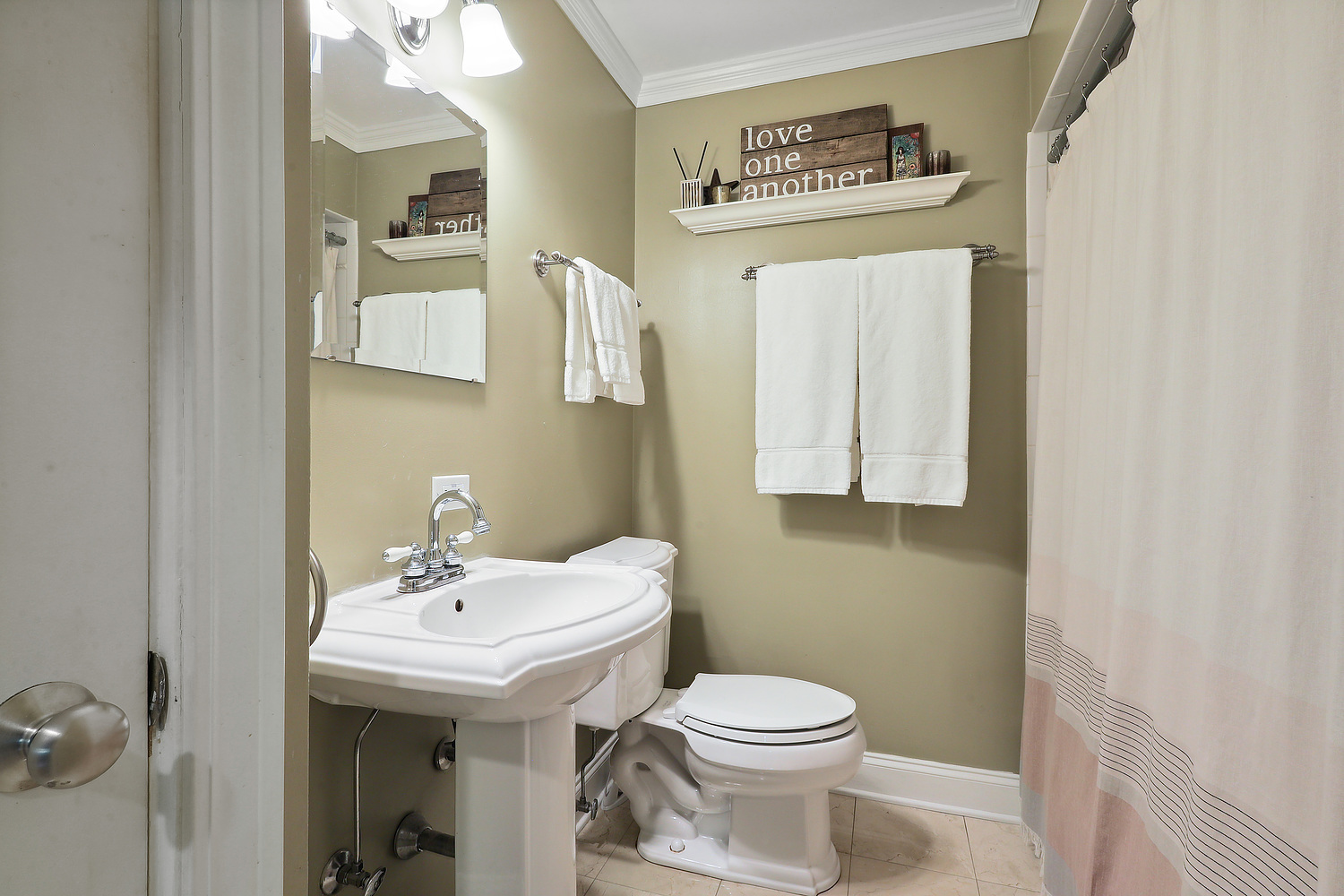 2432 Illinois Road Northbrook, IL 60062 - Photo 17 of 22 a bathroom with a sink and a mirror
