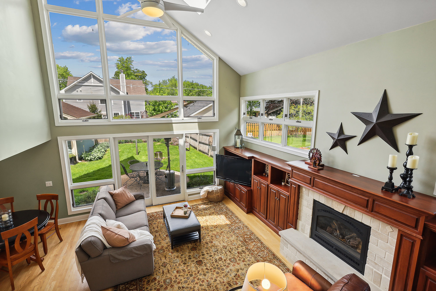 2432 Illinois Road Northbrook, IL 60062 - Photo 4 of 22 a living room with furniture fireplace and a large window