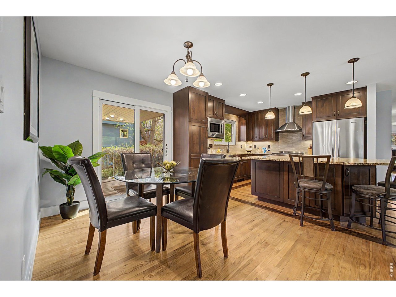 1453 Chestnut Place Boulder, CO 80304 - Photo 11 of 32 a view of a dining room with furniture and chandelier