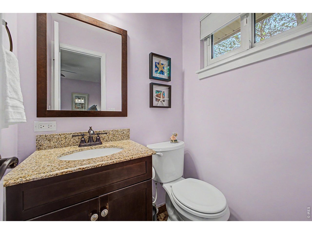 1453 Chestnut Place Boulder, CO 80304 - Photo 18 of 32 a bathroom with a toilet a sink and mirror
