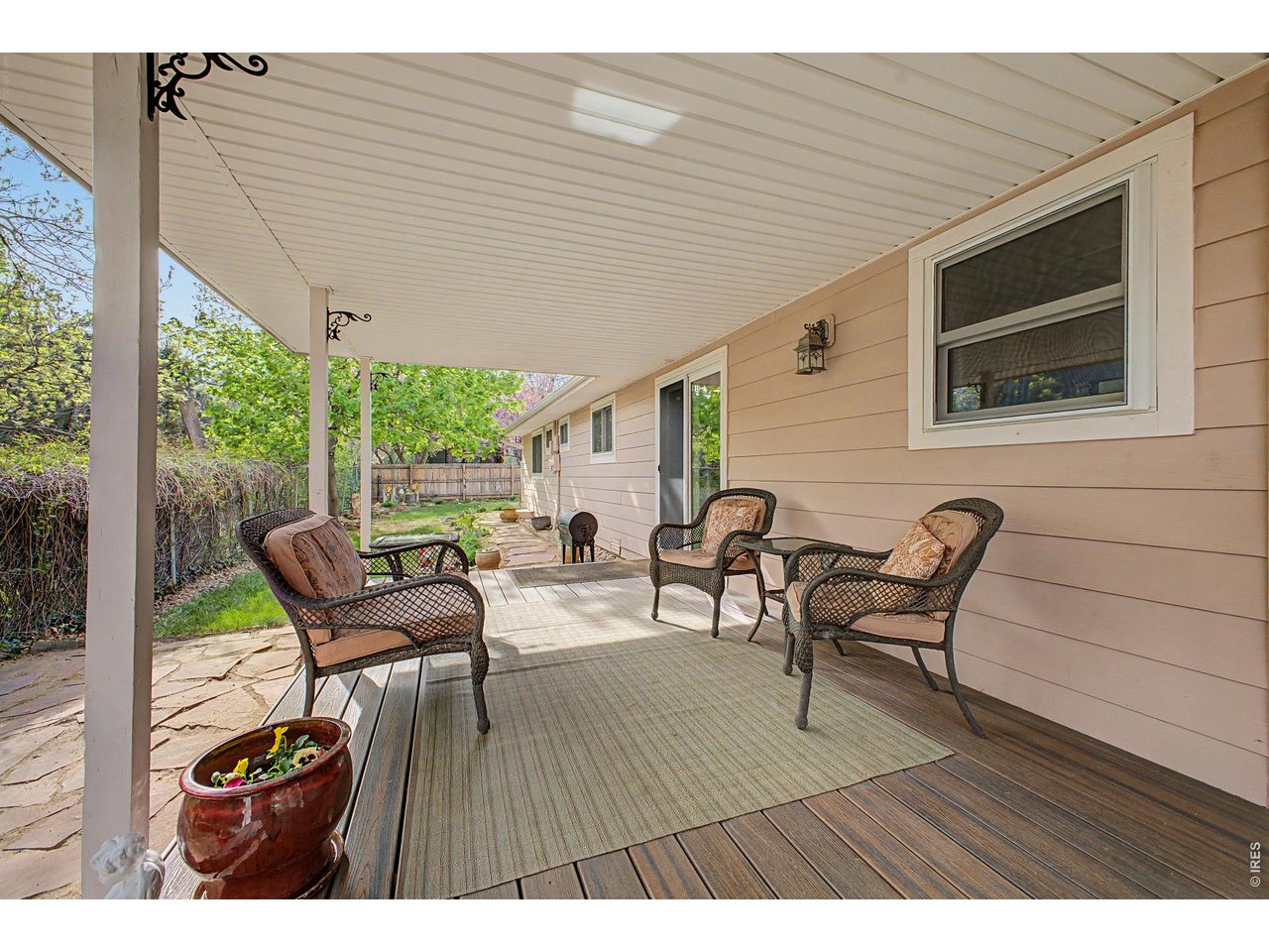 1453 Chestnut Place Boulder, CO 80304 - Photo 22 of 32 a balcony with wooden floor and outdoor seating