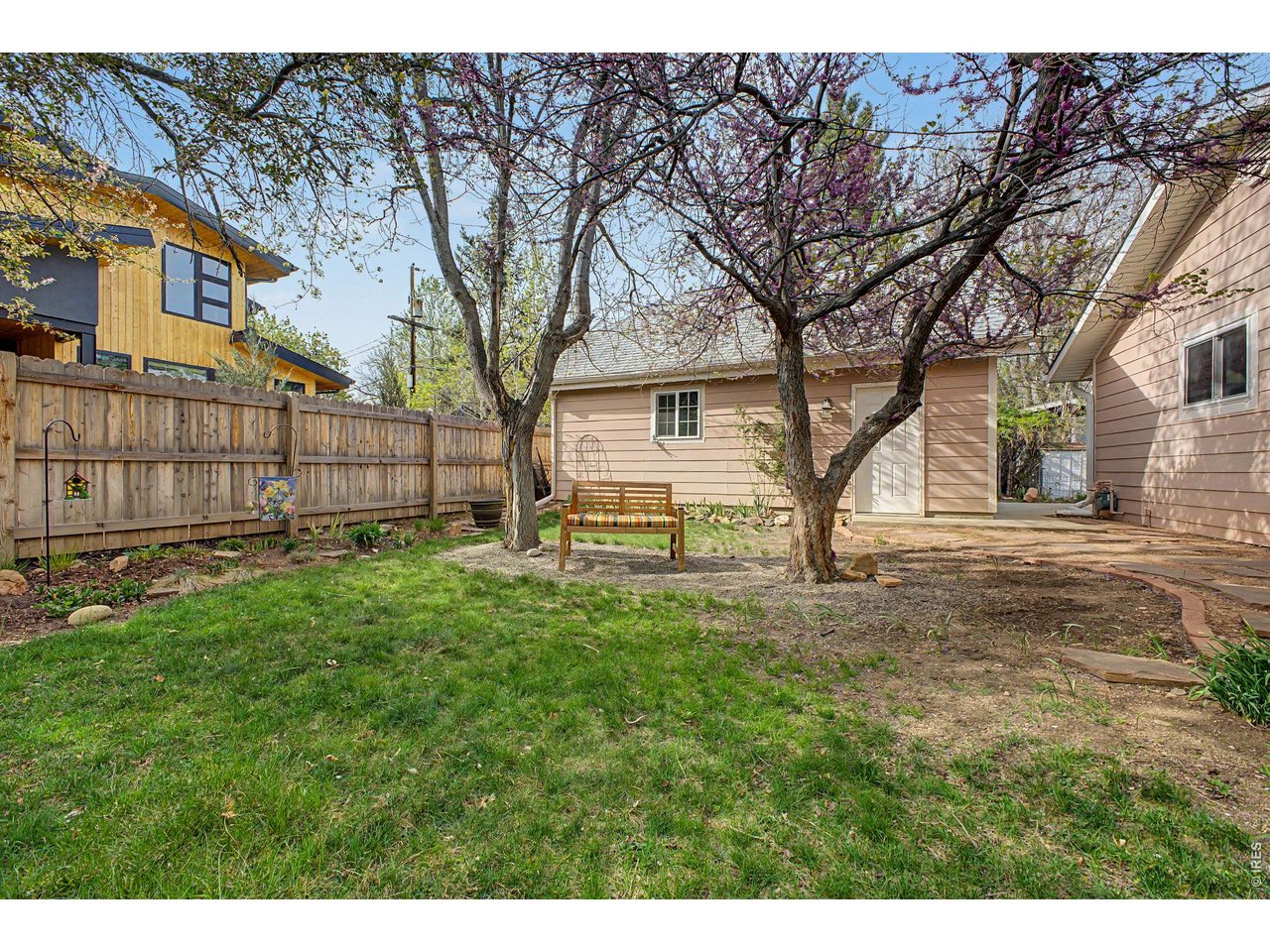 1453 Chestnut Place Boulder, CO 80304 - Photo 26 of 32 a view of a backyard with a large tree