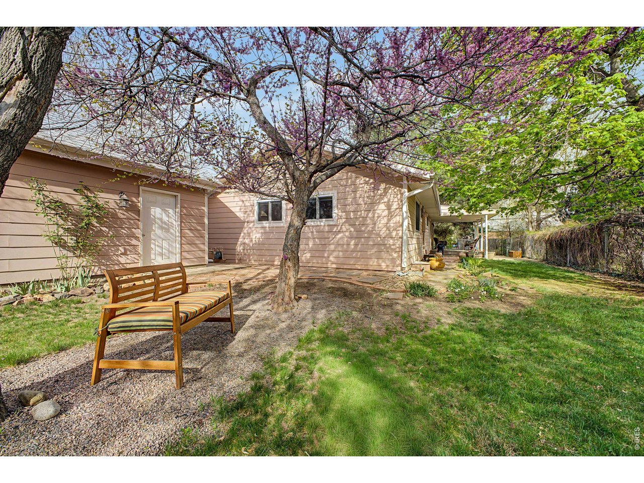 1453 Chestnut Place Boulder, CO 80304 - Photo 27 of 32 a backyard of a house with table and chairs