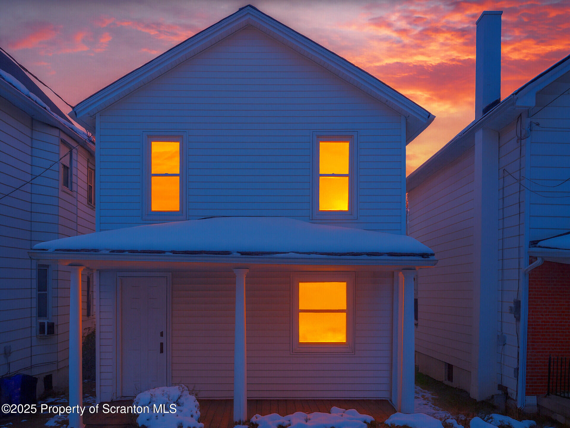 1215 Eynon Street Scranton, PA 18504 - Photo 1 of 32 a view of a brick house with a small yard
