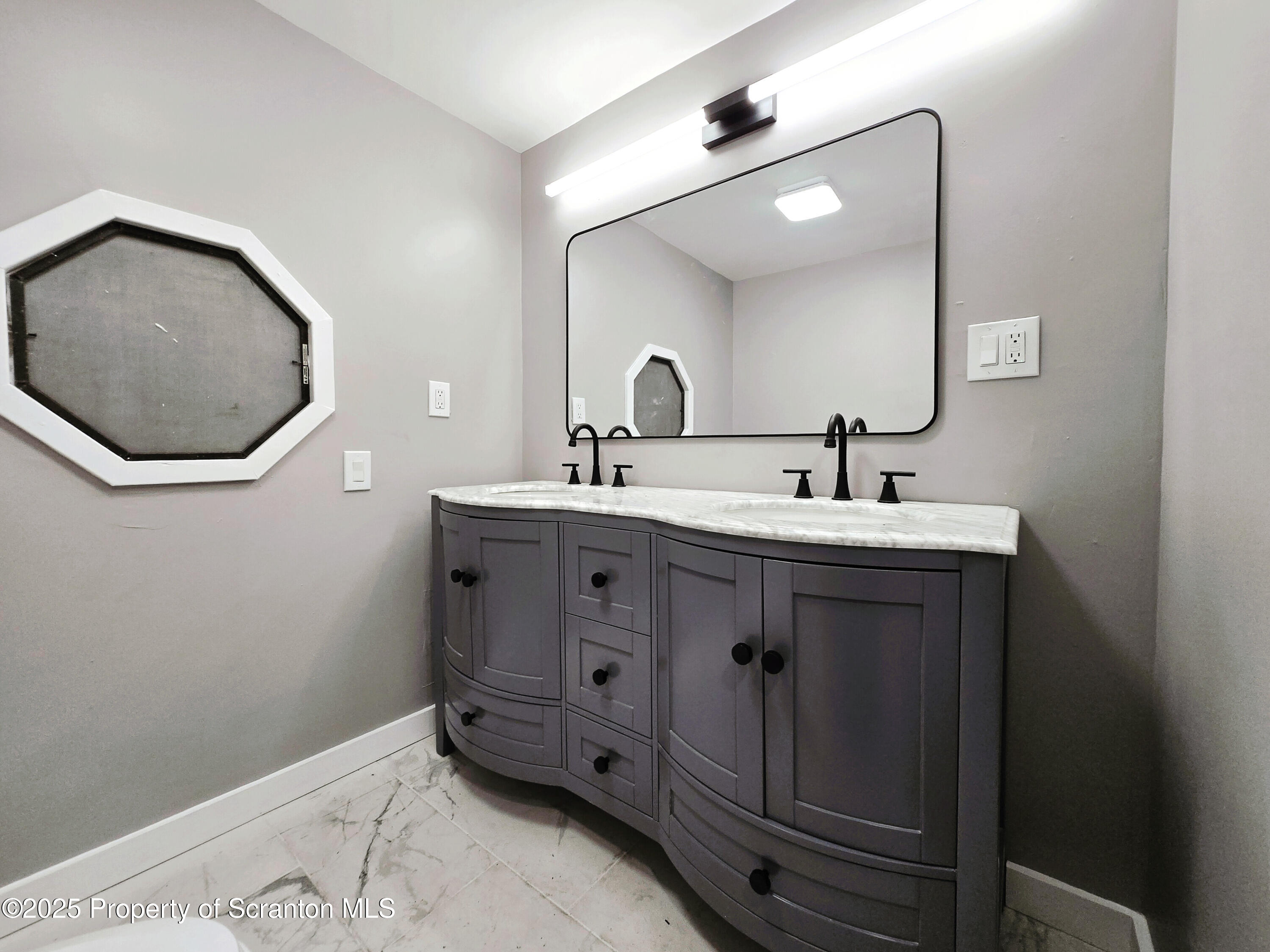 1215 Eynon Street Scranton, PA 18504 - Photo 11 of 32 a bathroom with a sink and a mirror
