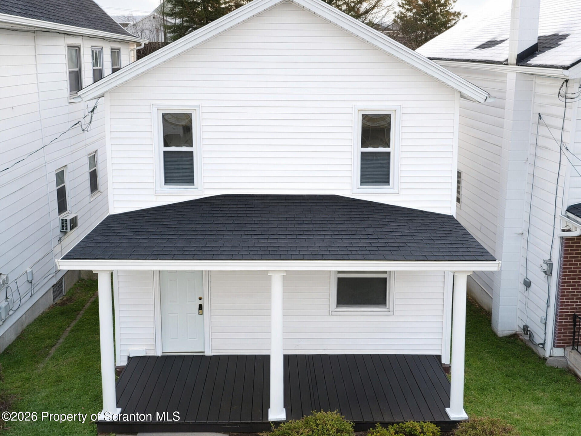1215 Eynon Street Scranton, PA 18504 - Photo 2 of 23 a front view of a house with a yard