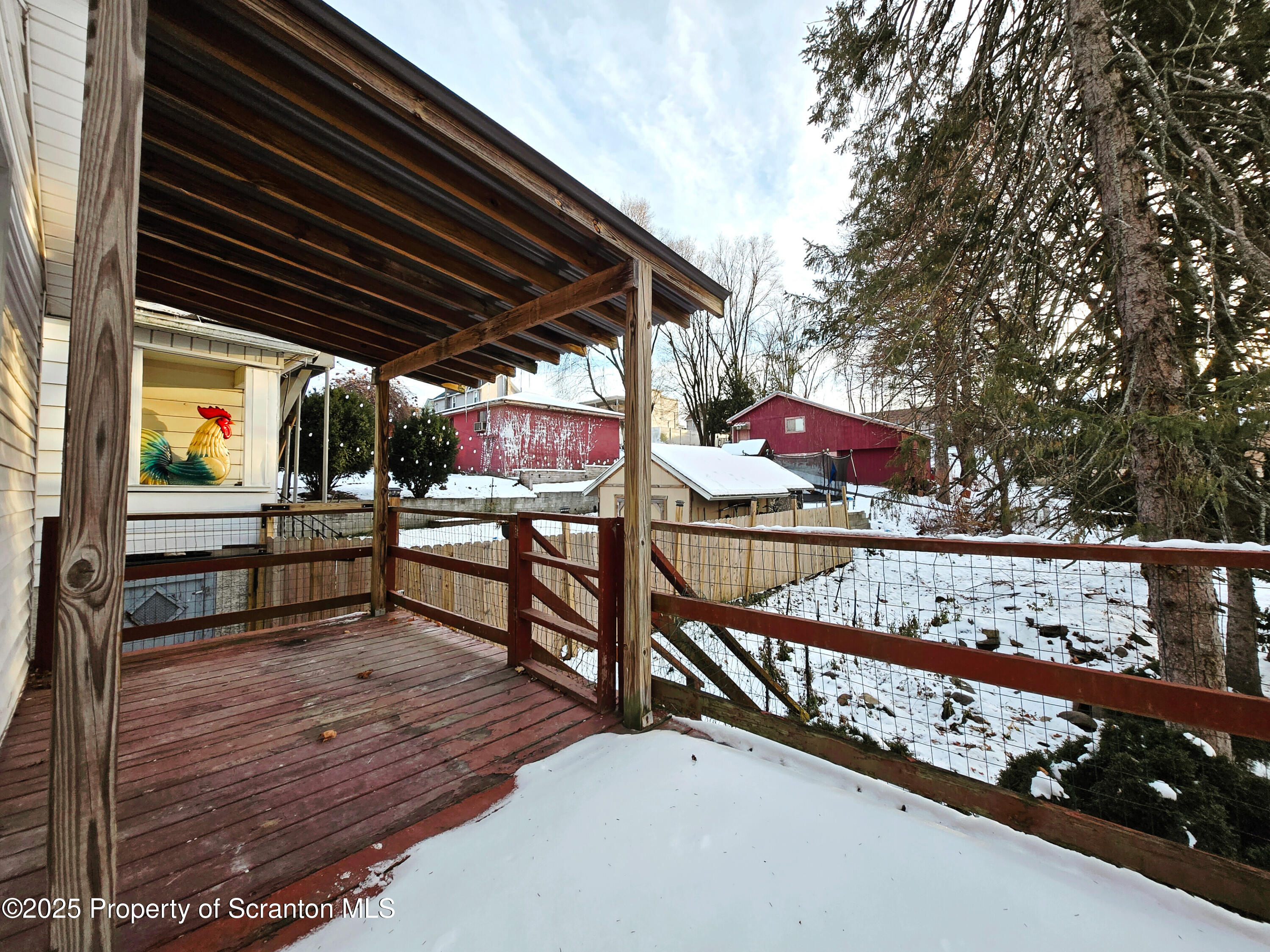 1215 Eynon Street Scranton, PA 18504 - Photo 27 of 32 a view of an outdoor sitting area with wooden fence