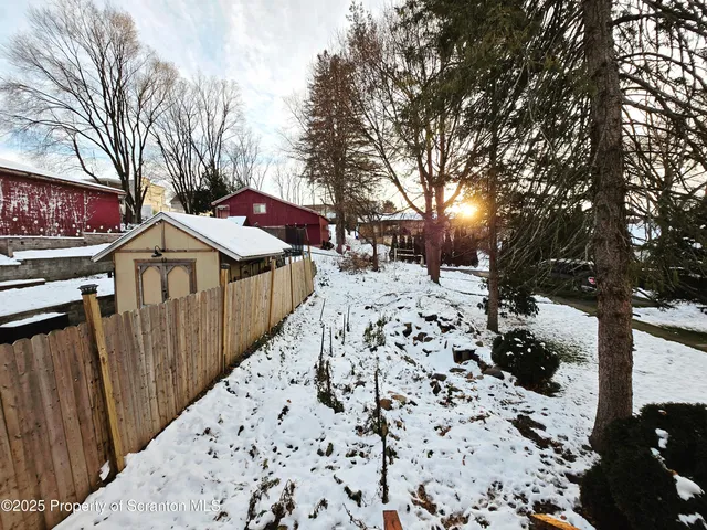 a view of a covered with snow in the background