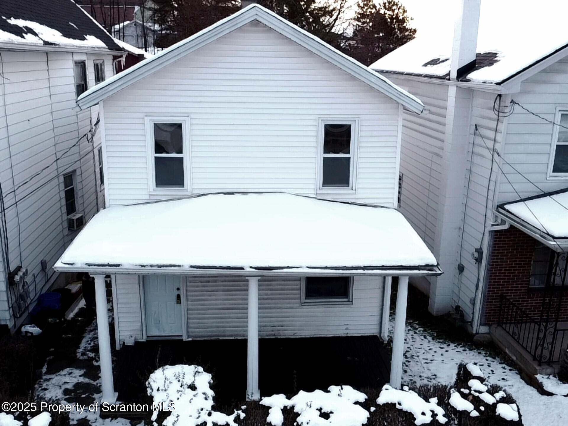 1215 Eynon Street Scranton, PA 18504 - Photo 3 of 32 a view of a house with a porch and furniture