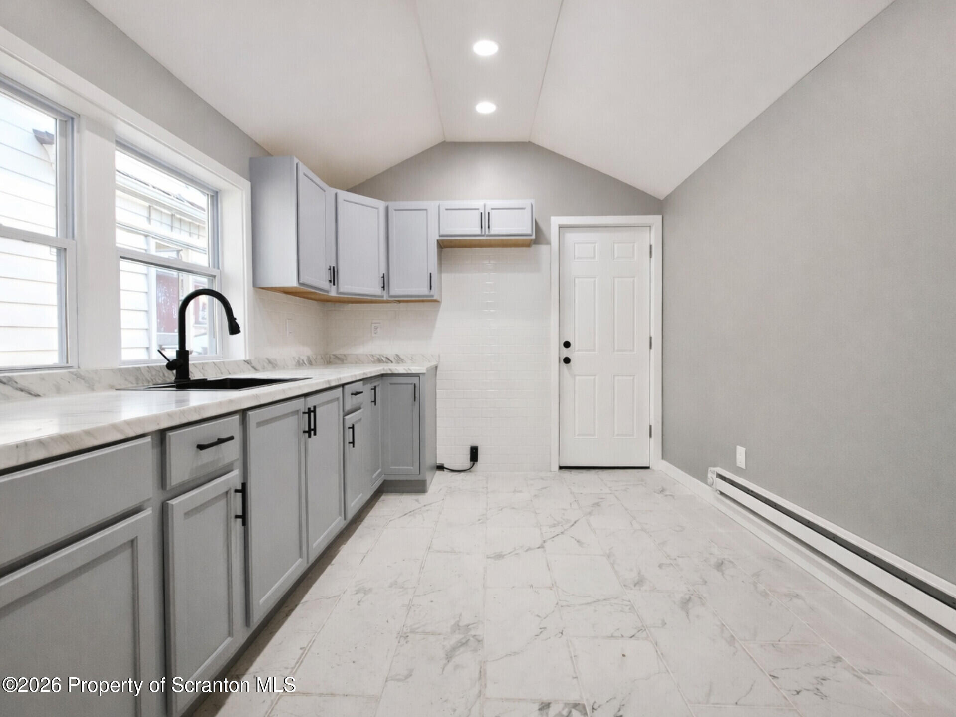 1215 Eynon Street Scranton, PA 18504 - Photo 4 of 23 a kitchen with a sink cabinets and window