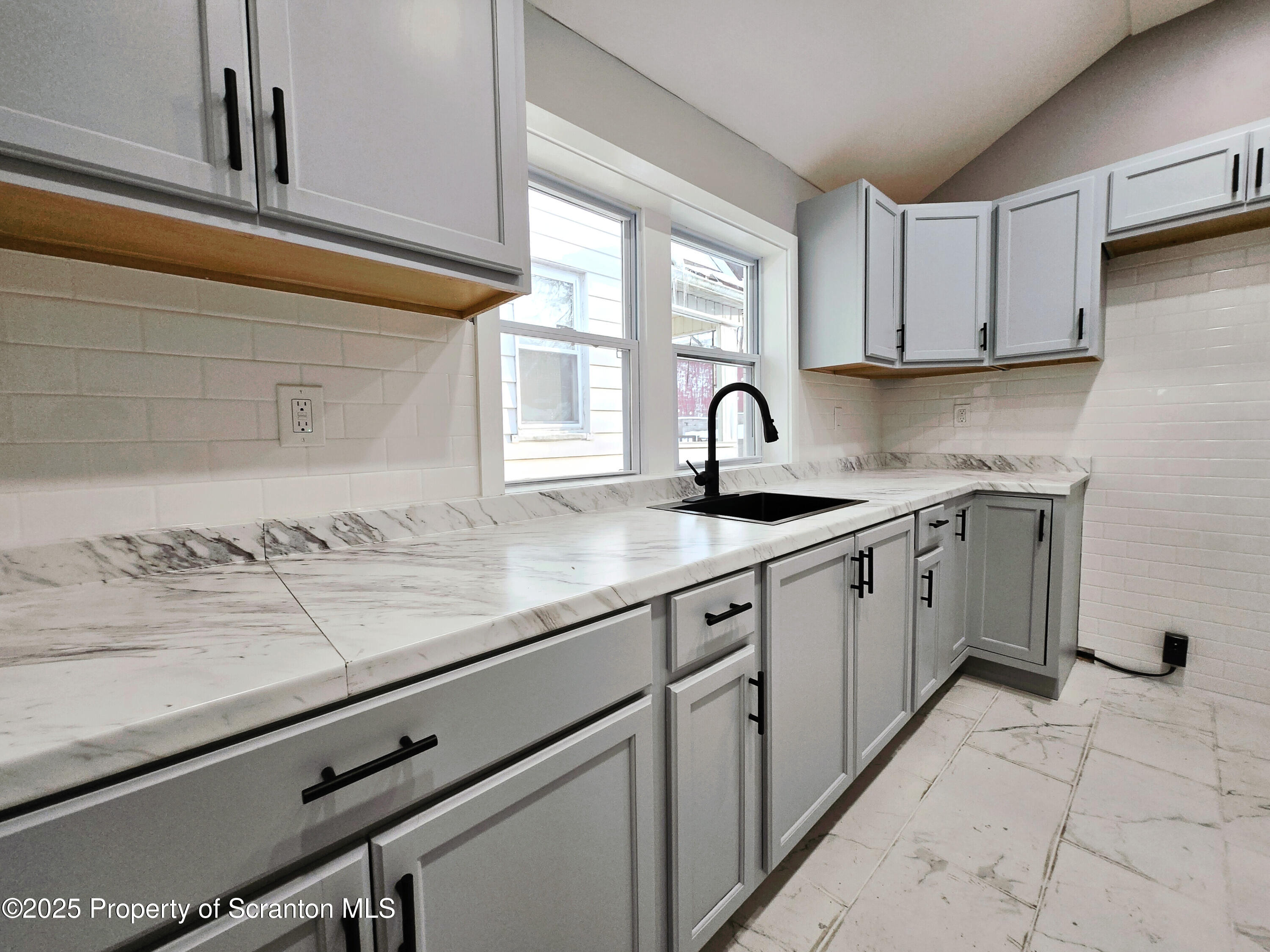 1215 Eynon Street Scranton, PA 18504 - Photo 7 of 32 a kitchen with a sink cabinets and window