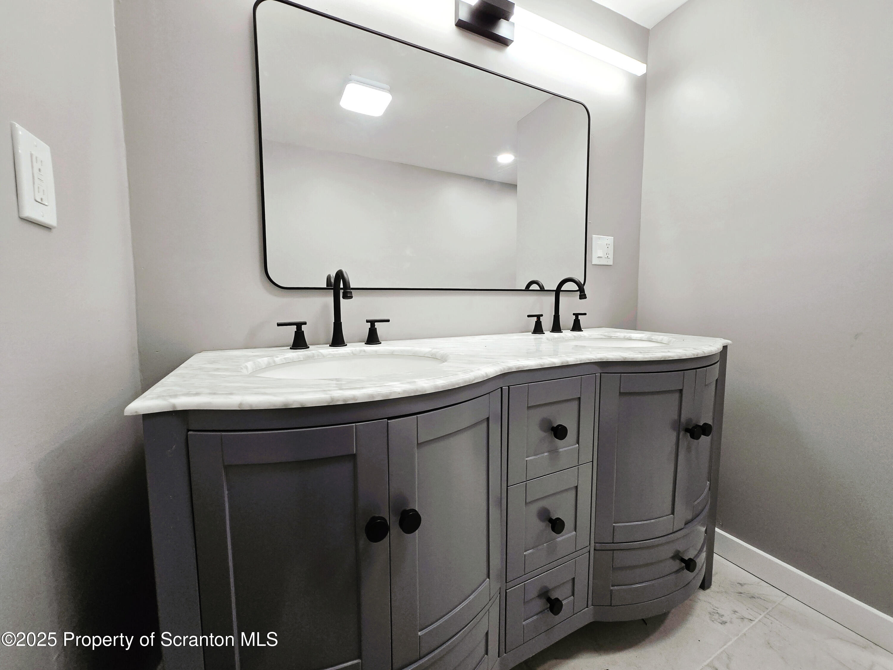 1215 Eynon Street Scranton, PA 18504 - Photo 8 of 23 a bathroom with a sink and a mirror