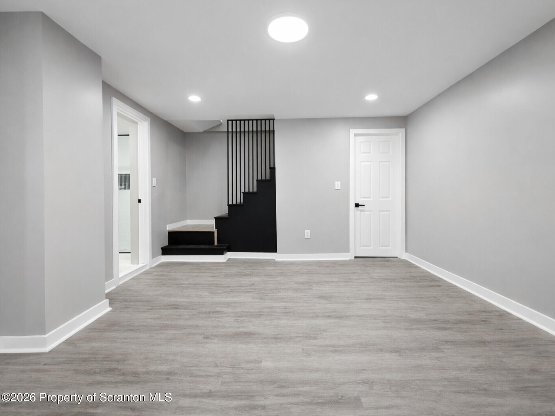 1215 Eynon Street Scranton, PA 18504 - Photo 10 of 23 a view of an empty room with wooden floor