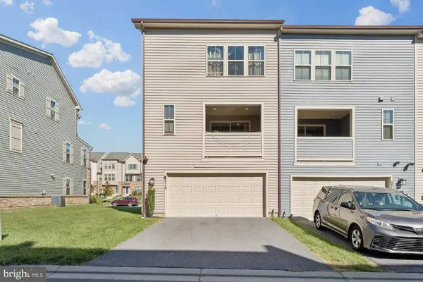 a view of a car park in front of a house