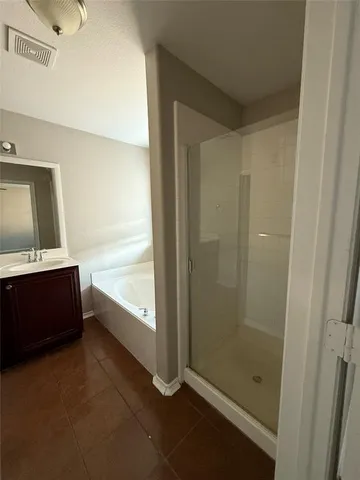 a bathroom with a bathtub and a sink