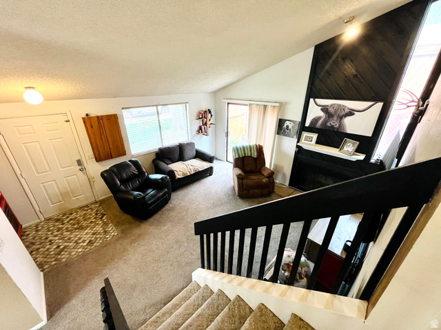 1450 Sagewood Road, Unit 16 Price, UT 84501 - Photo 3 of 15 Inviting formal living room with soaring vaulted ceilings and gas fireplace.