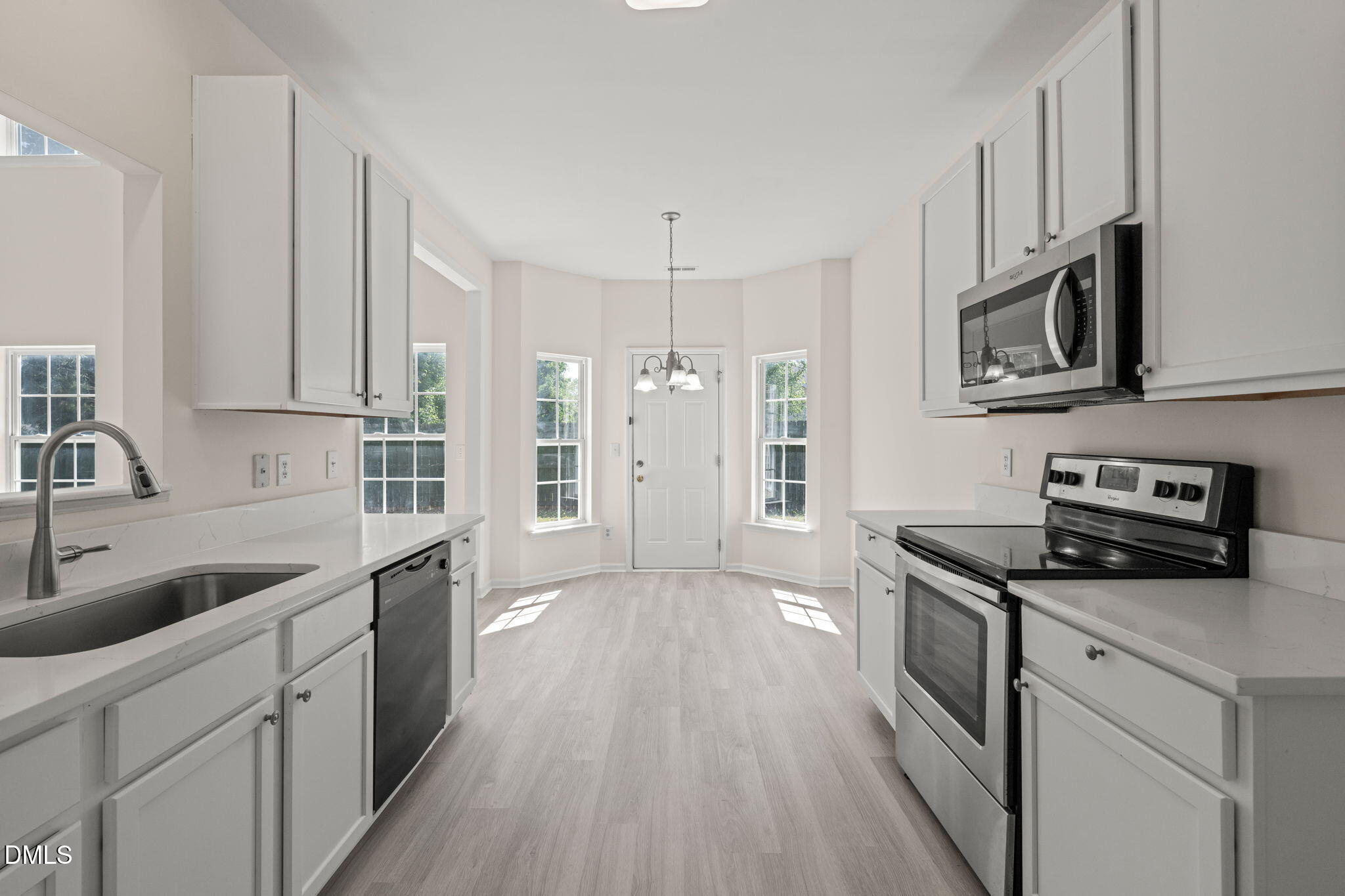 3207 Geary Trail Raleigh, NC 27610 - Photo 12 of 55 a kitchen with stainless steel appliances granite countertop a sink stove and microwave