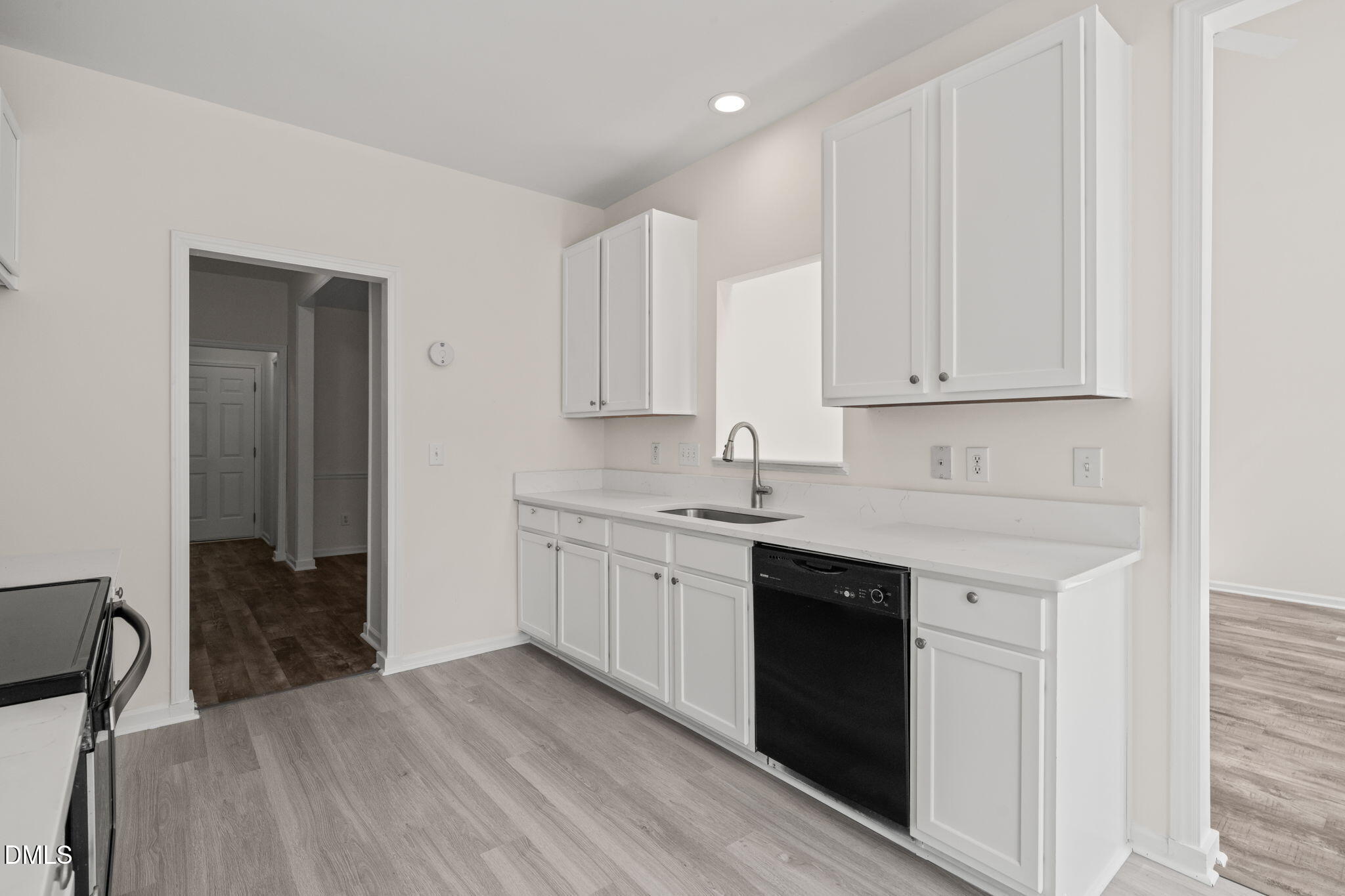 3207 Geary Trail Raleigh, NC 27610 - Photo 13 of 55 a kitchen with granite countertop white cabinets and sink