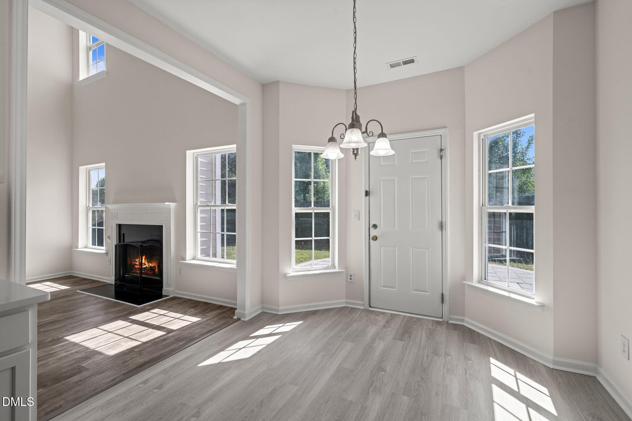 3207 Geary Trail Raleigh, NC 27610 - Photo 15 of 55 a view of livingroom with window fireplace and windows