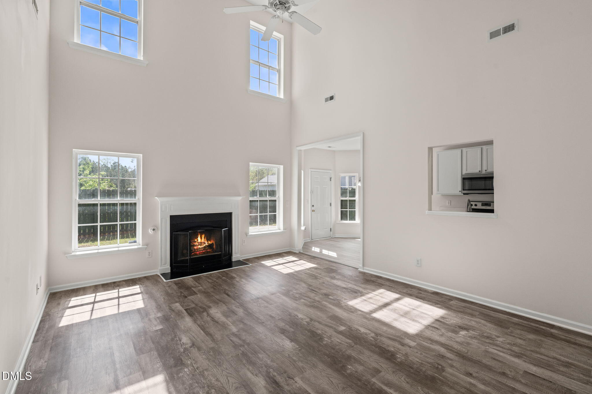 3207 Geary Trail Raleigh, NC 27610 - Photo 19 of 55 a view of empty room with a fireplace and wooden floor