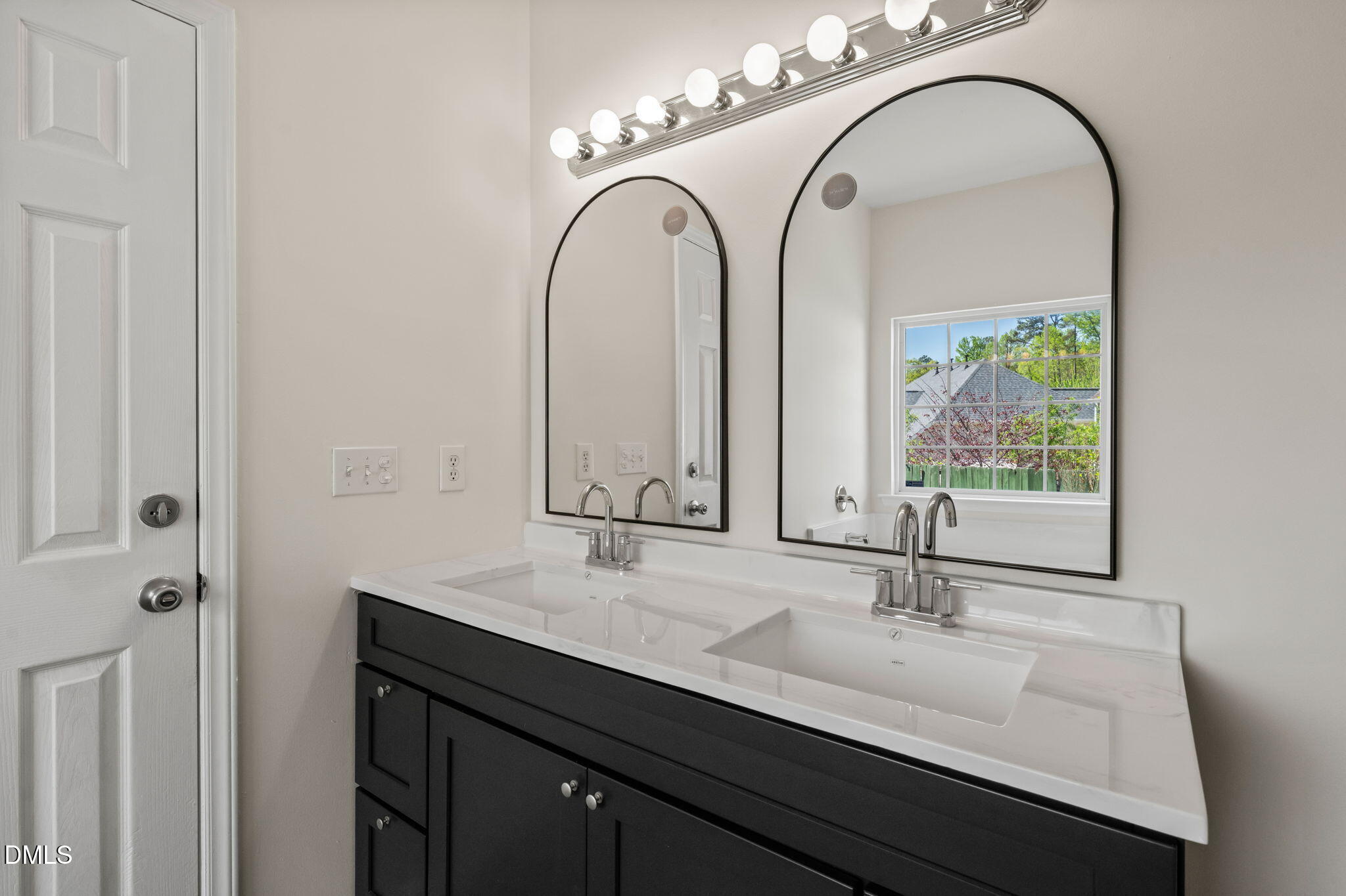 3207 Geary Trail Raleigh, NC 27610 - Photo 22 of 55 a bathroom with a double vanity sink and a mirror